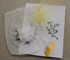 The pattern: traced, pricked, and pounced. The fluff of canary-colored silk is the remains of