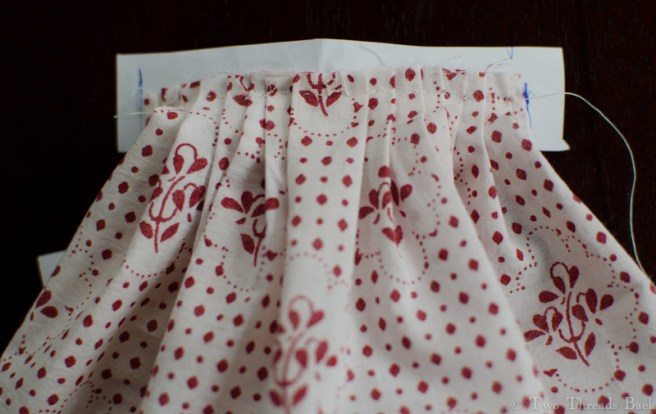 I had to sew the skirt to a paper strip in order to get the pleats even.