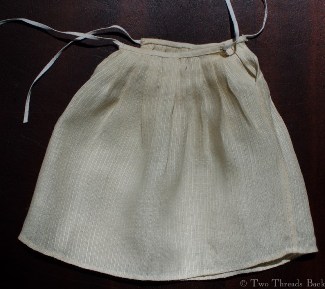 I was complaining earlier about the accumulation of stuff around Pharaby's middle. At this point I decided to replace the waistband on her under petticoat to make it more to scale - and reduce her girth.