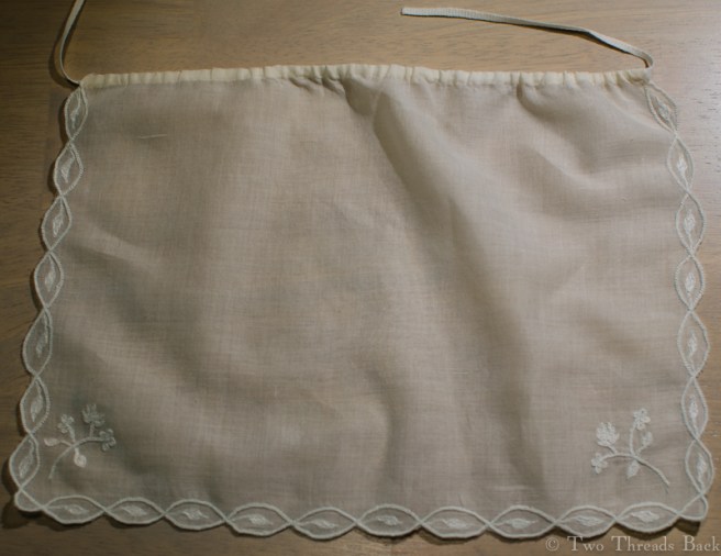 The edges are buttonholed, the leaves are simple running or darning stitches, and the sprigs are chainstitch. The leaves looked horrible when I was working them, but once they were all done it wasn't quite so bad.