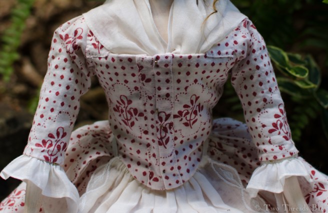 Her fichu, tucked in place.