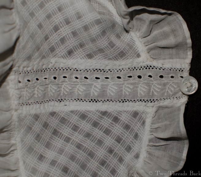 A peek at the insertion. Notice the embroidery was meant for an edge rather than the center of a pattern. You use what you've got, right? Or maybe she had one of those "Aarrgh!" moments once she sewed it in. I'm familiar with those.