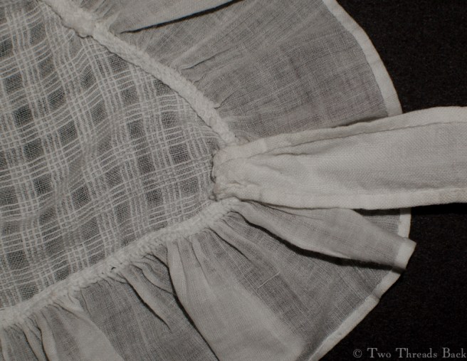 A peek at how the tie is tacked on - and by now, you know what this is.