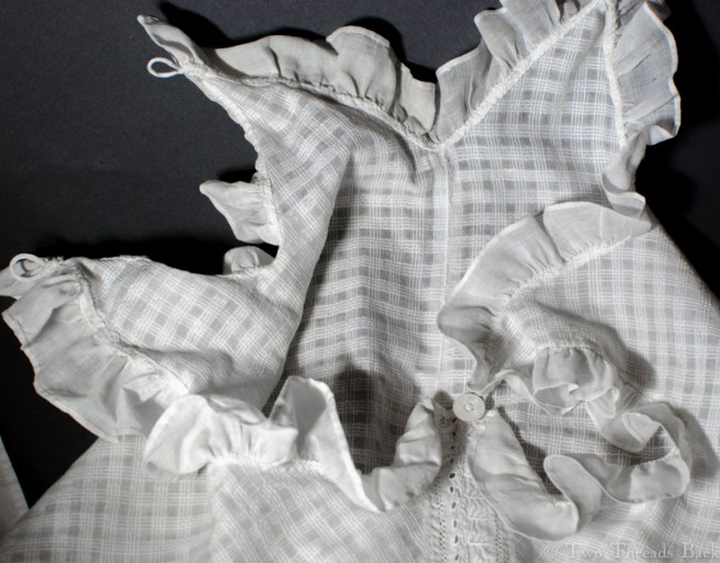 With one loop & button fastened.